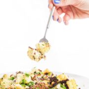 Roasted cauliflower parmesan with fork in view