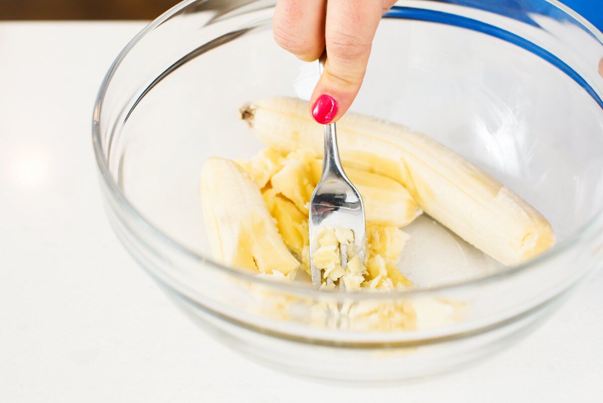 mashing bananas in a bowl