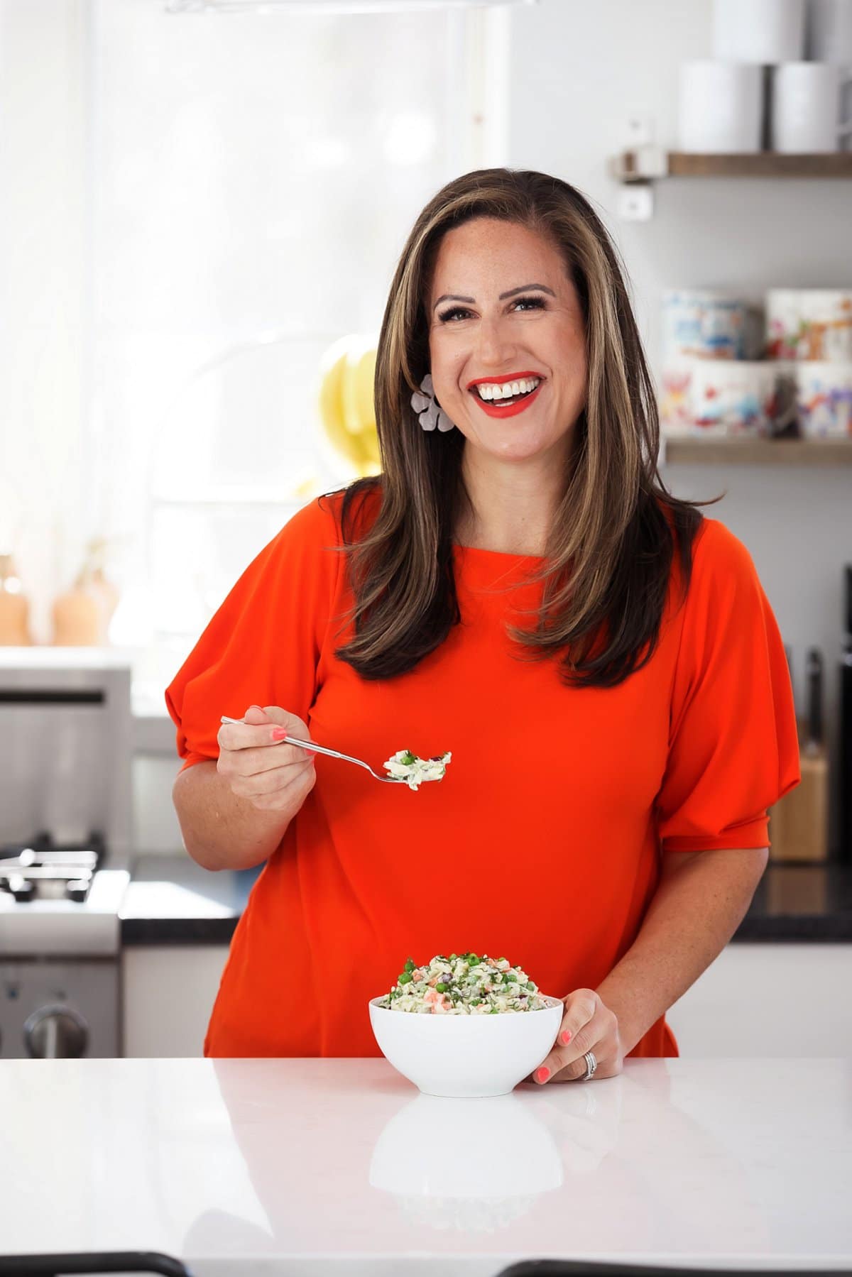 Liz eating orzo salad with dill dressing