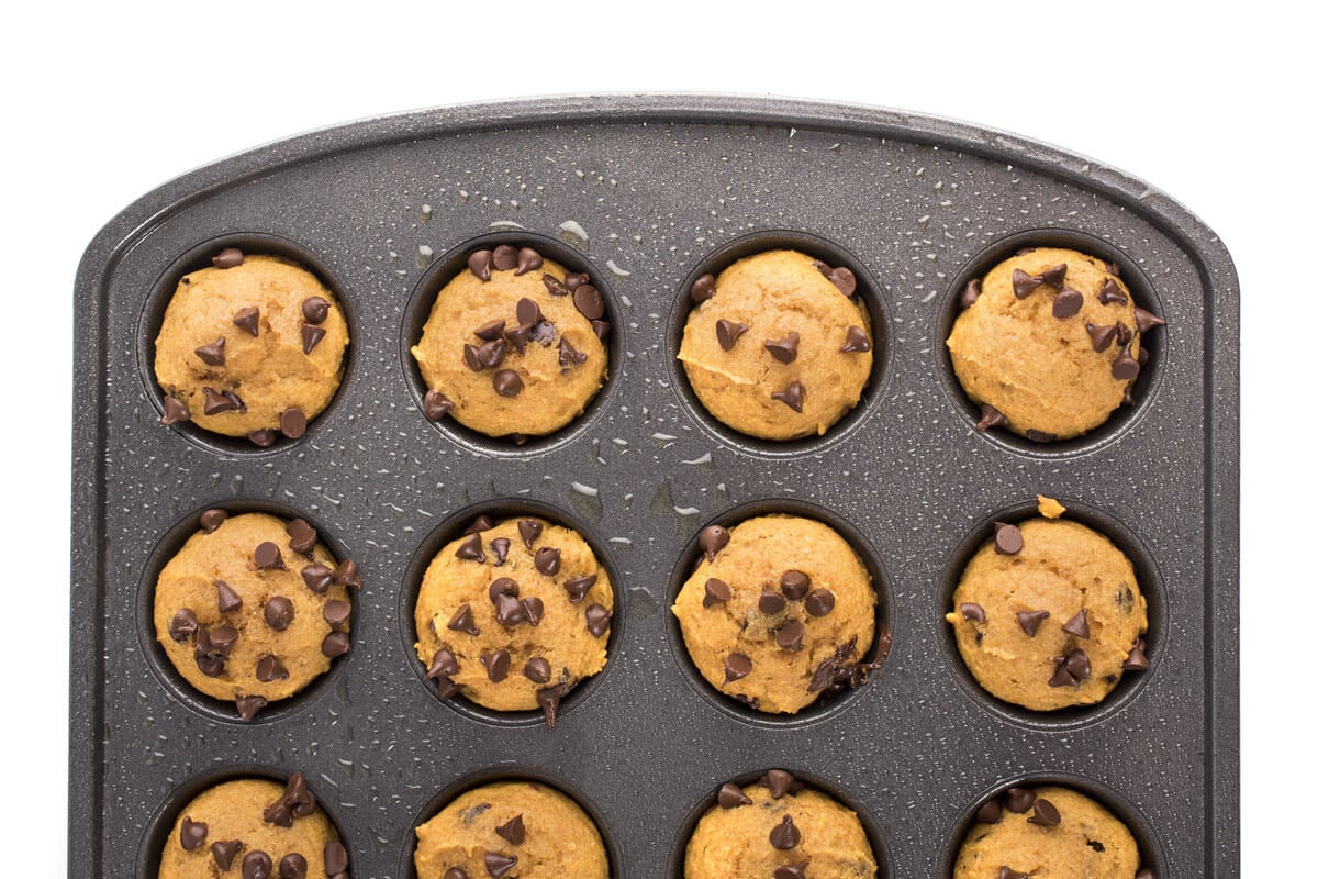 Mini Pumpkin Chocolate Chip Muffins in a muffin tin
