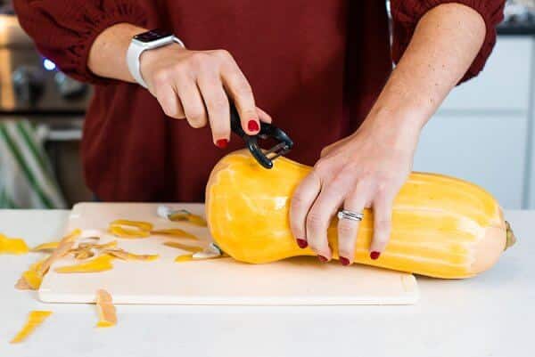 peeling a butternut squash