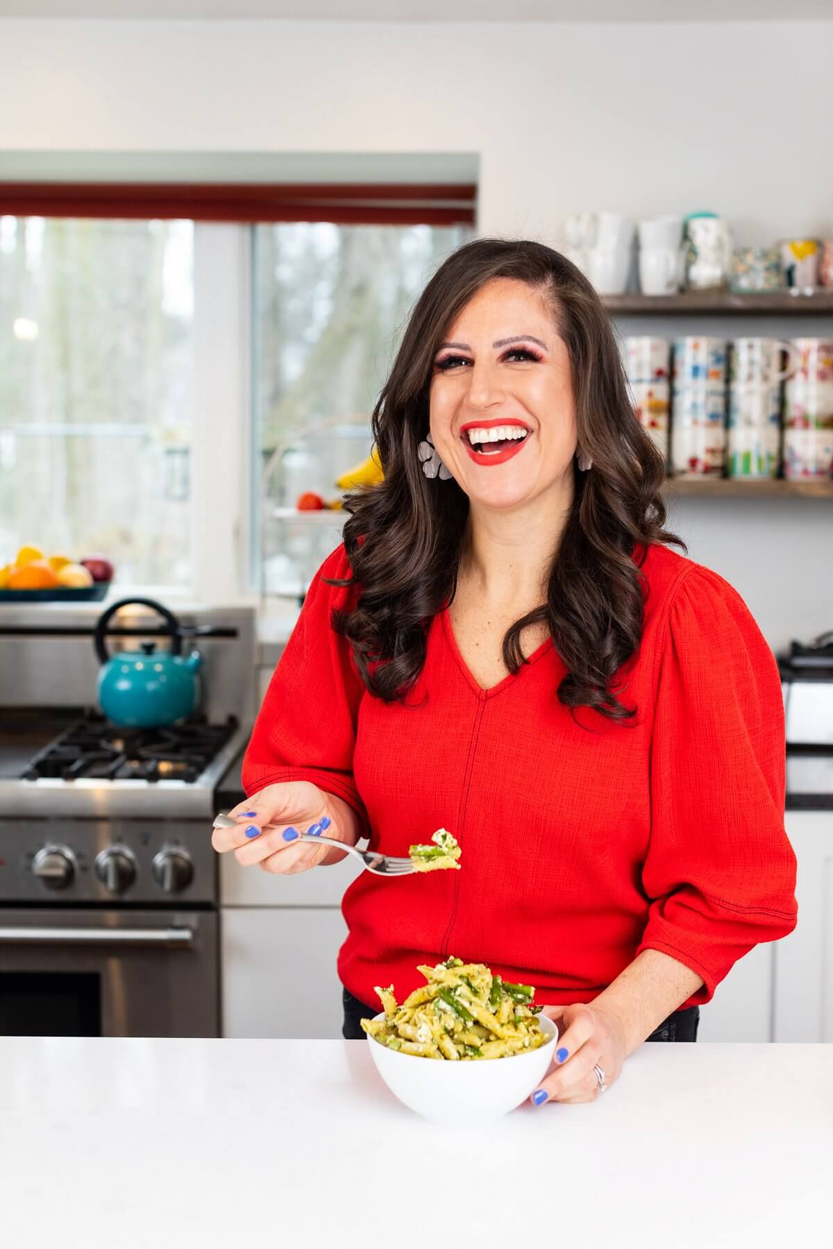 Liz eating pesto pasta