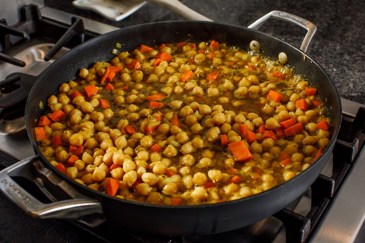 Jamaican Curry Chickpea meal simmering in skillet