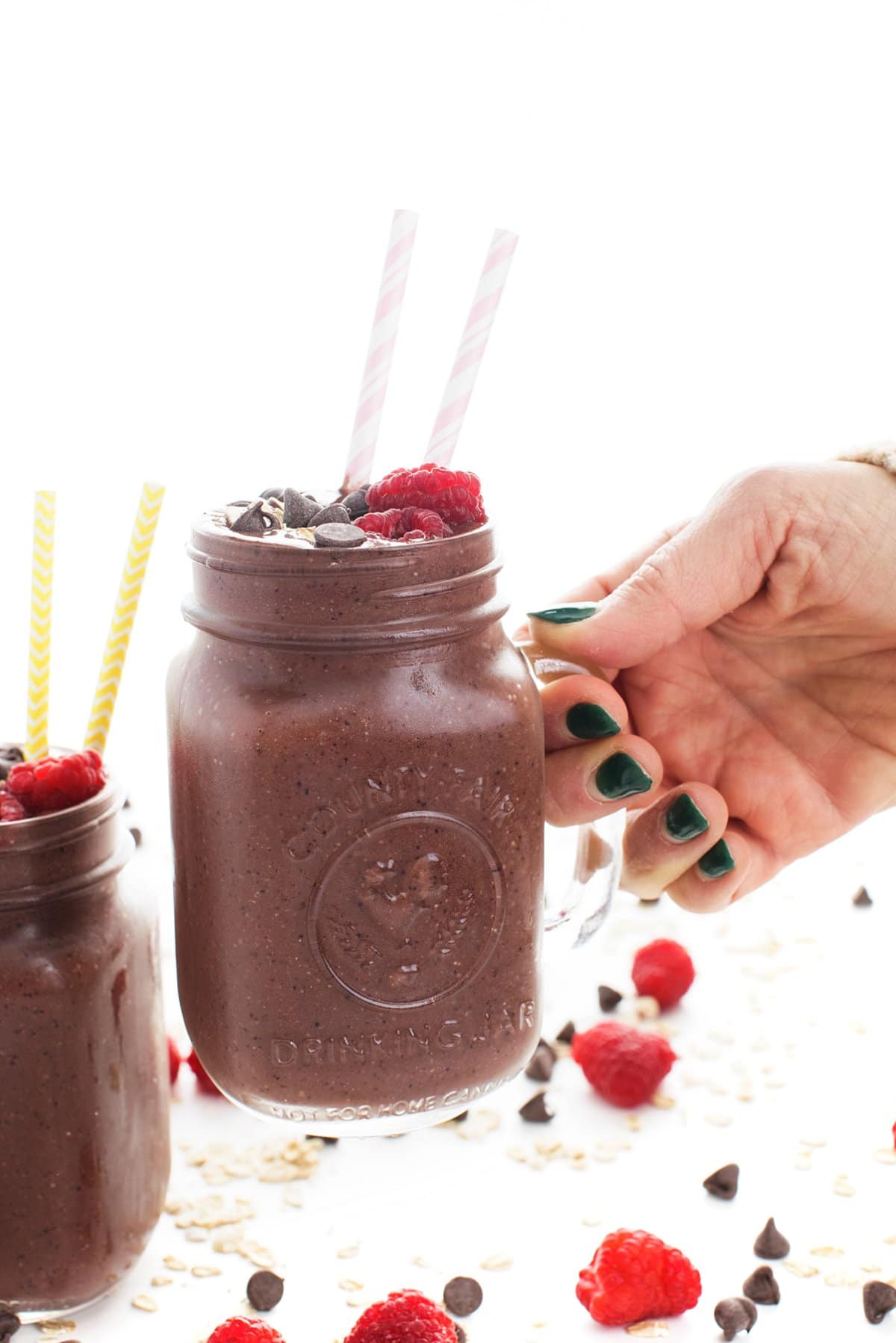 Holding a chocolate oatmeal smoothie