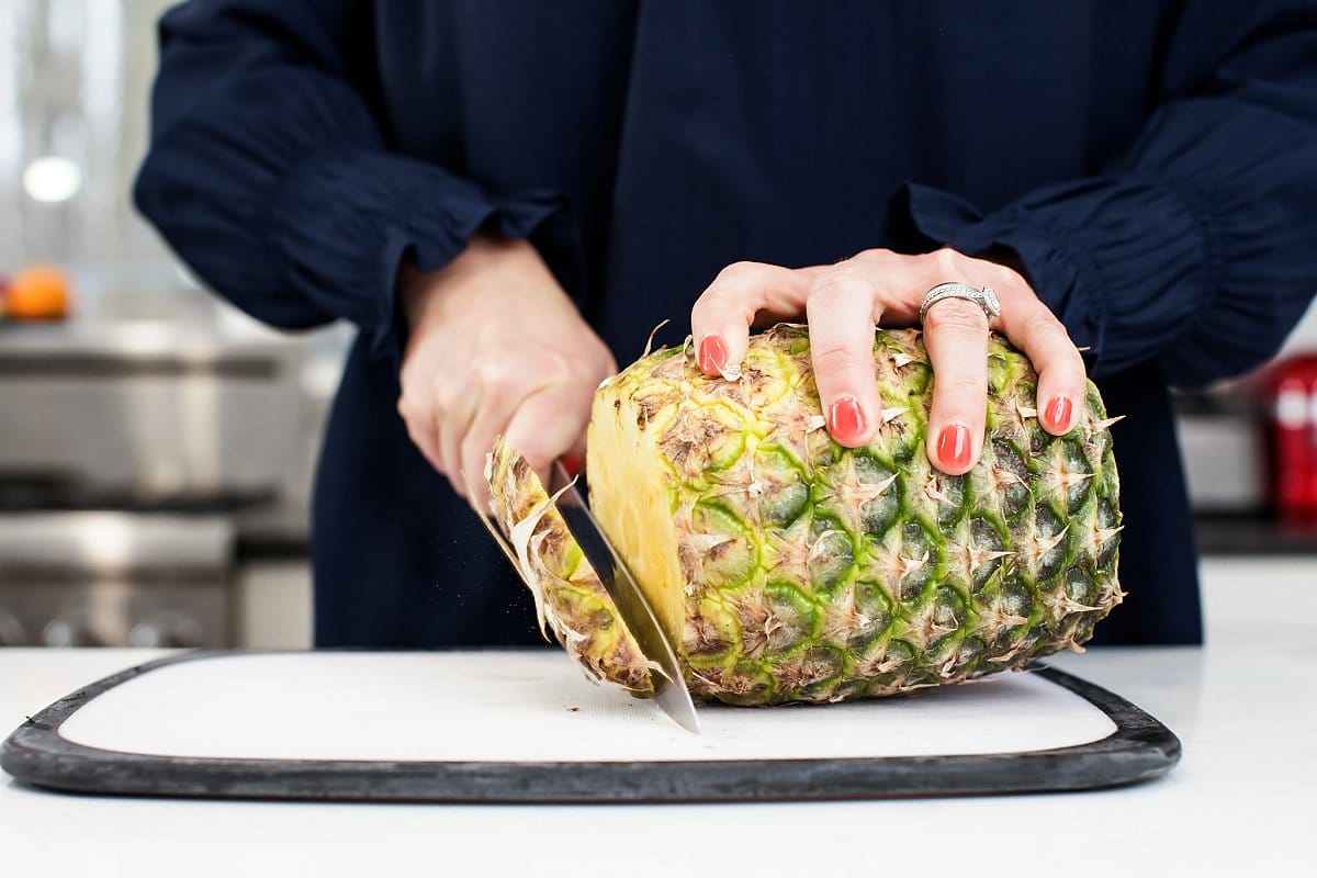 Liz cutting pineapple
