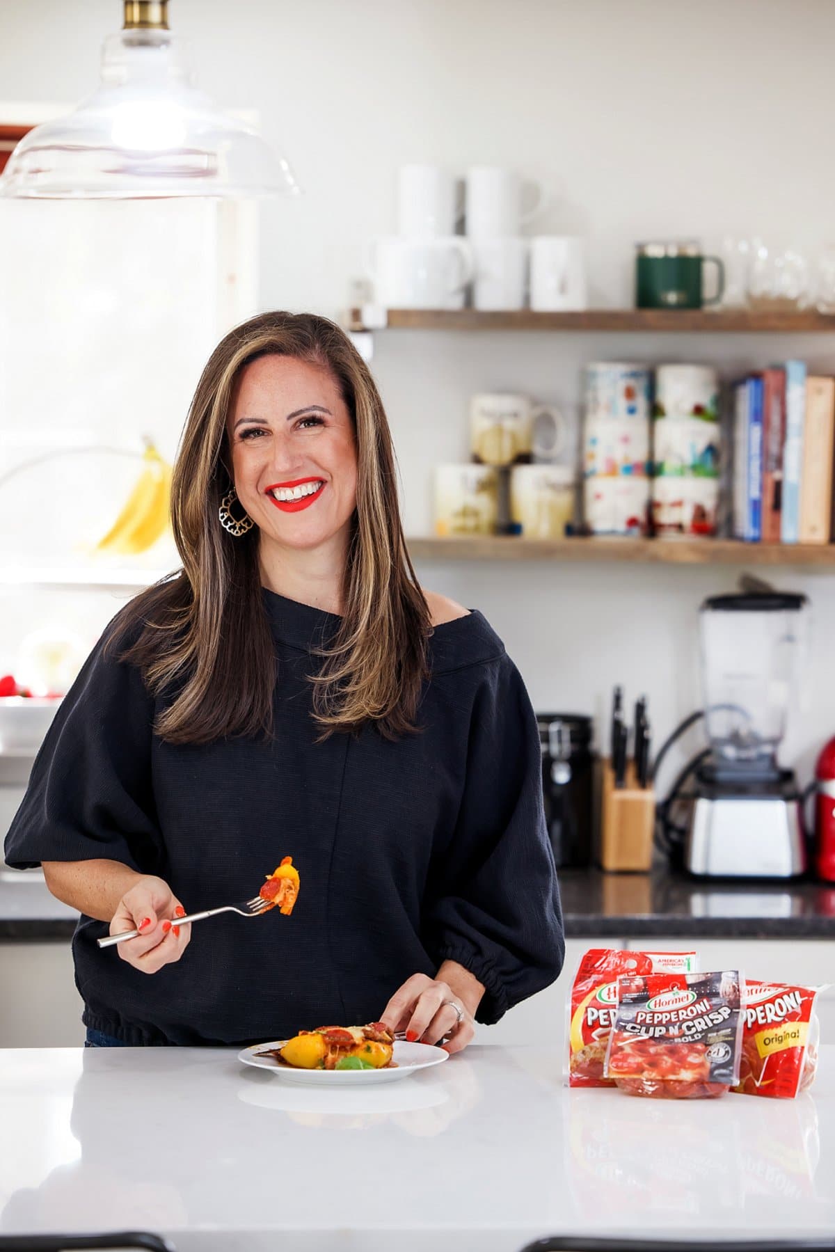 person eating pizza stuffed pepper