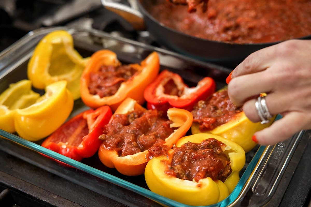stuffing peppers with sausage and pepperoni