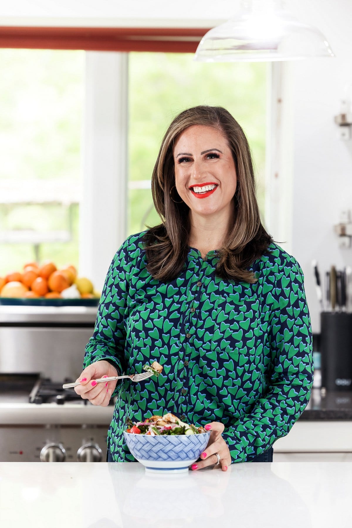 Liz eating chicken salad with tahini dressing.