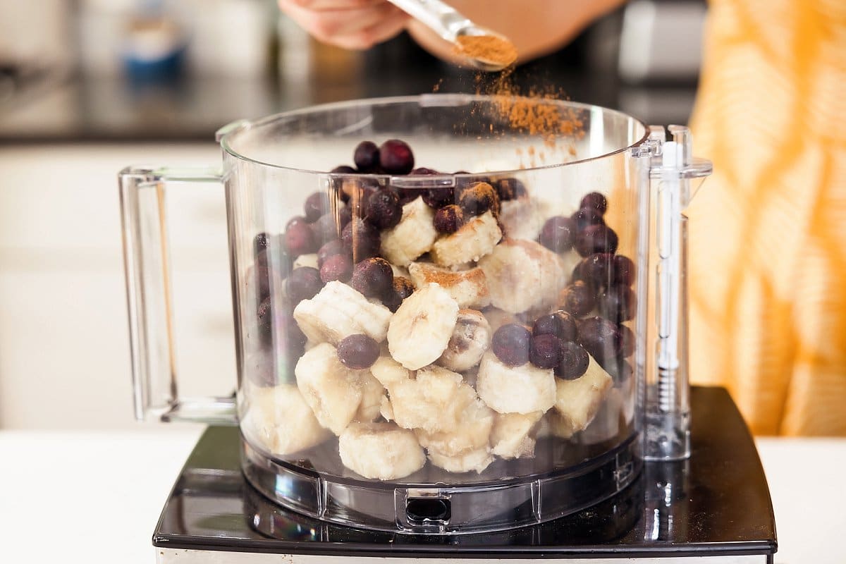 Adding cinnamon to vegan blueberry nice cream