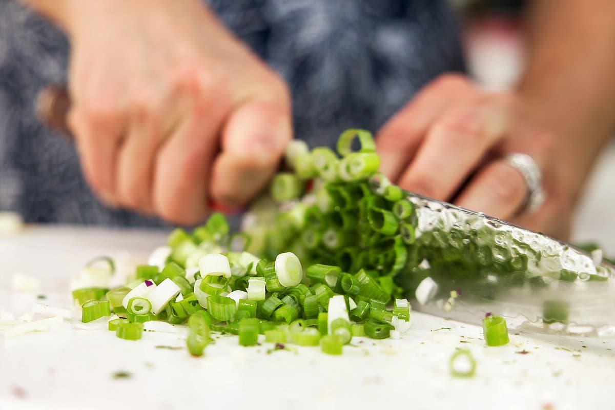 scallions being chopped