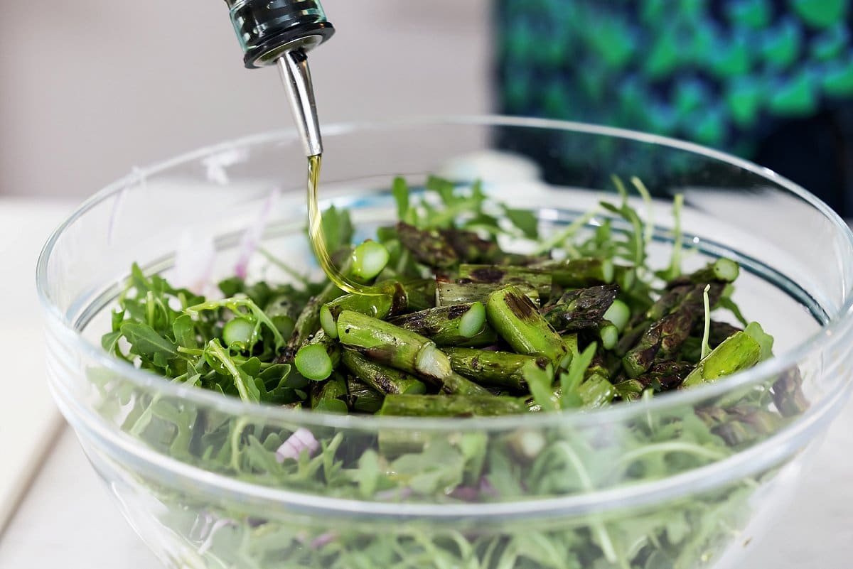 Liz Drizzling Bowl of Asapragus with Oil