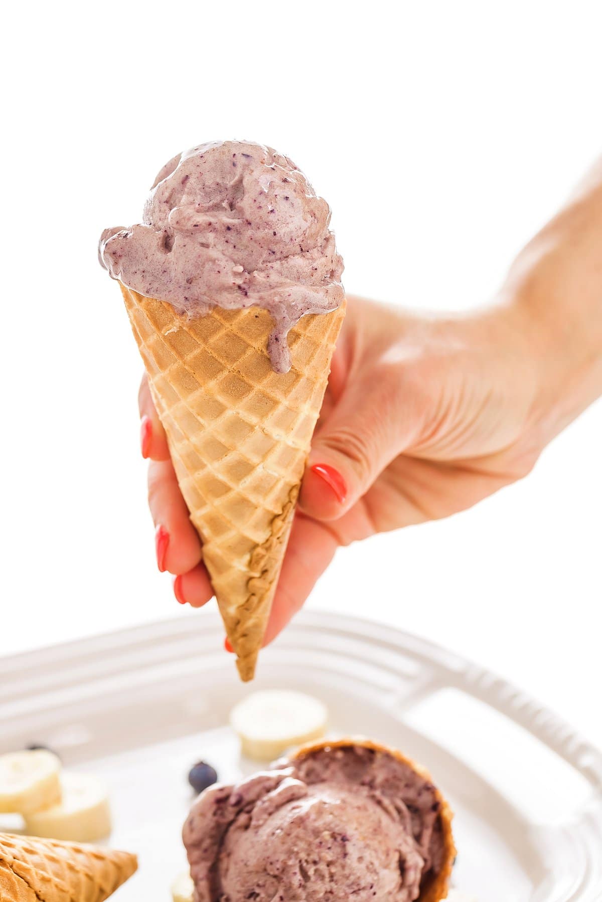 scoop of vegan blueberry nice cream in a cake cone