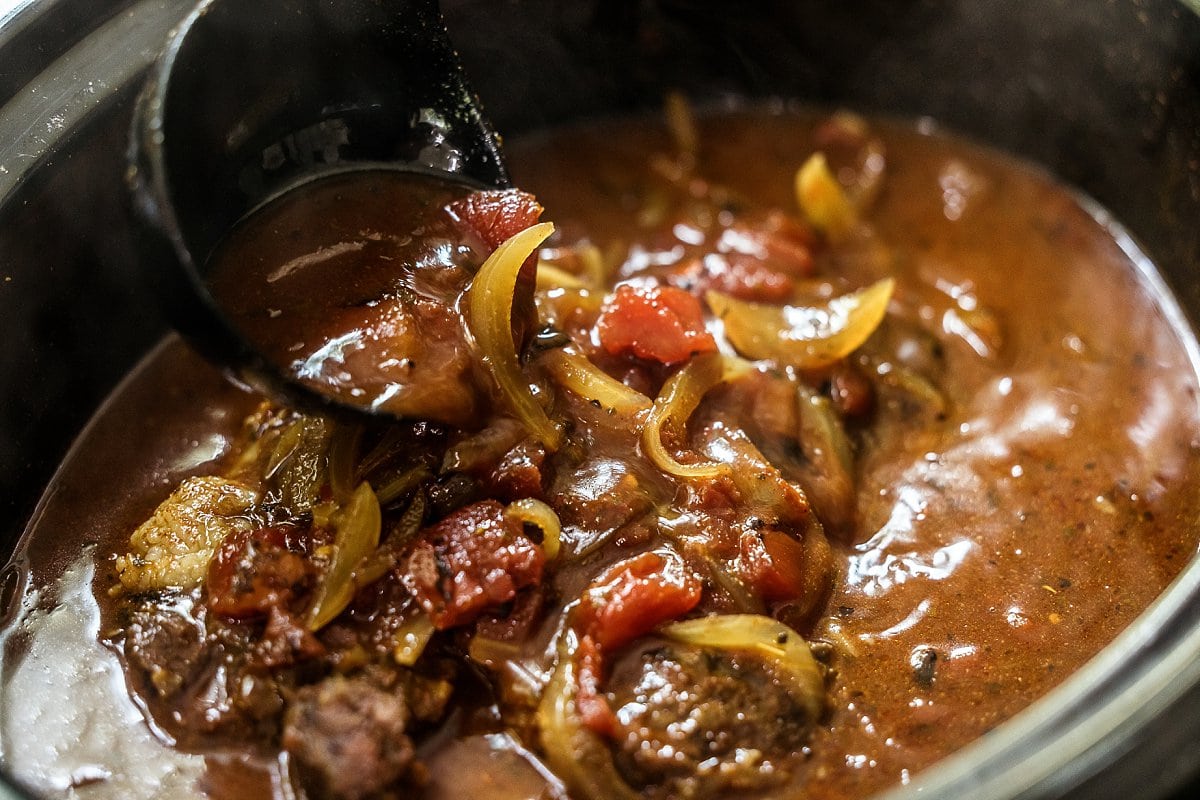 stirring slow cooker shredded beef
