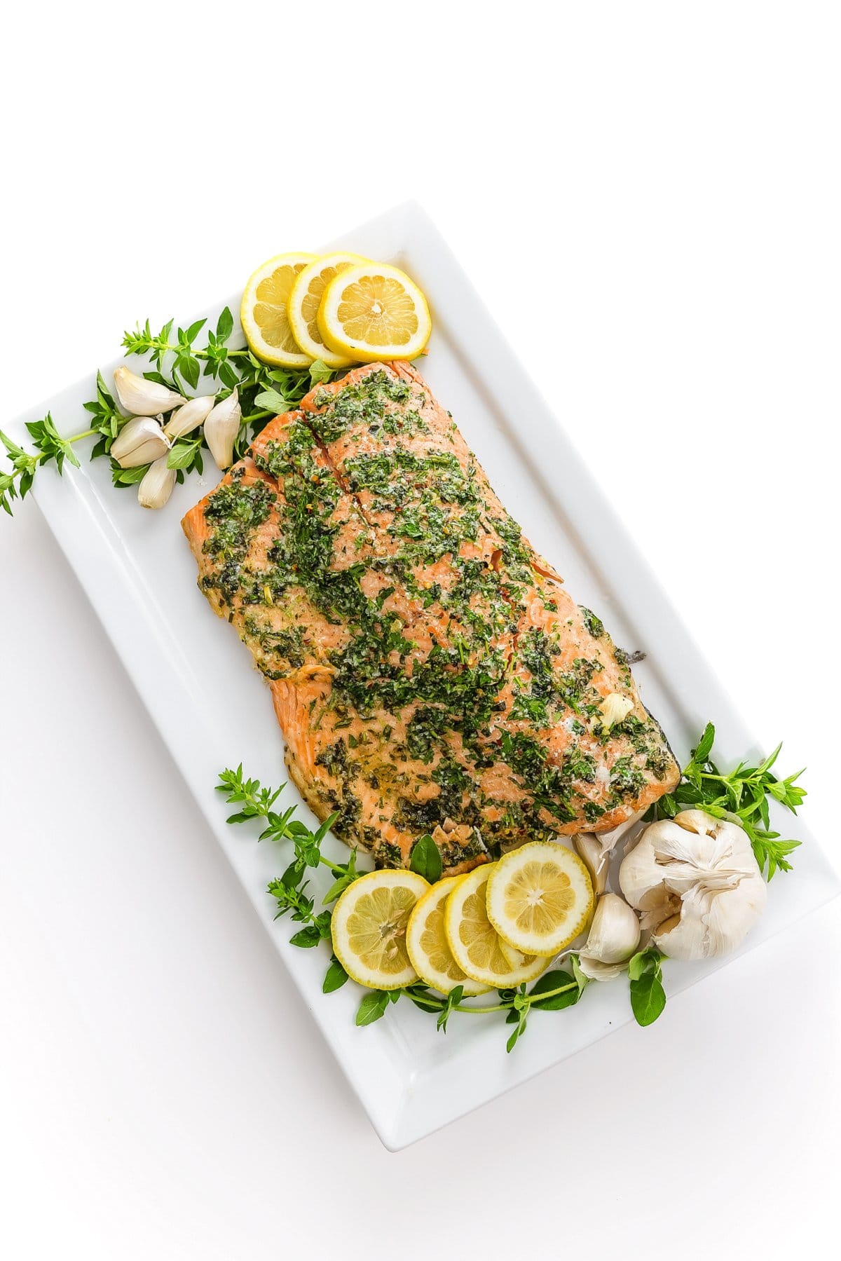 top view of baked salmon with fresh herbs