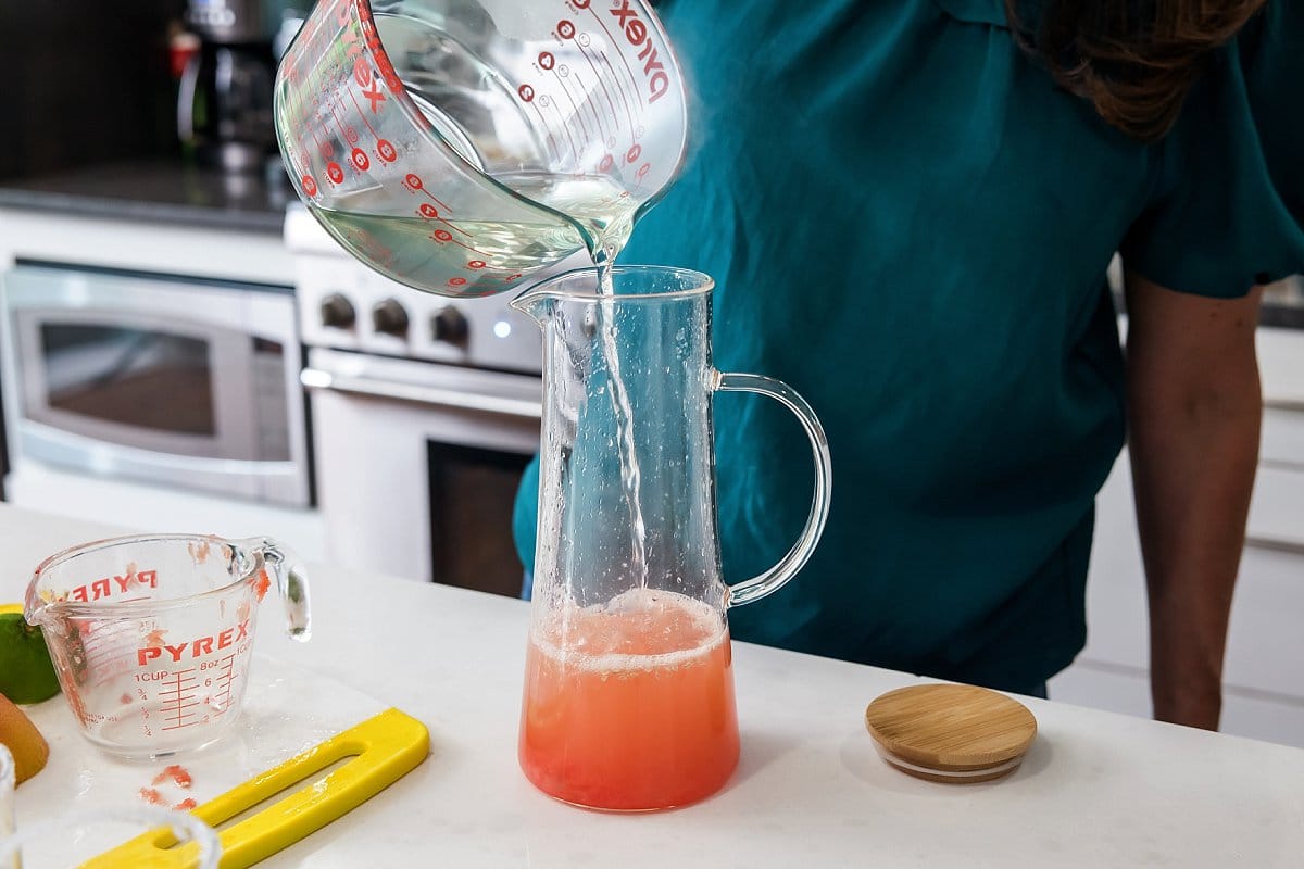 Pouring simple syrup into pitcher