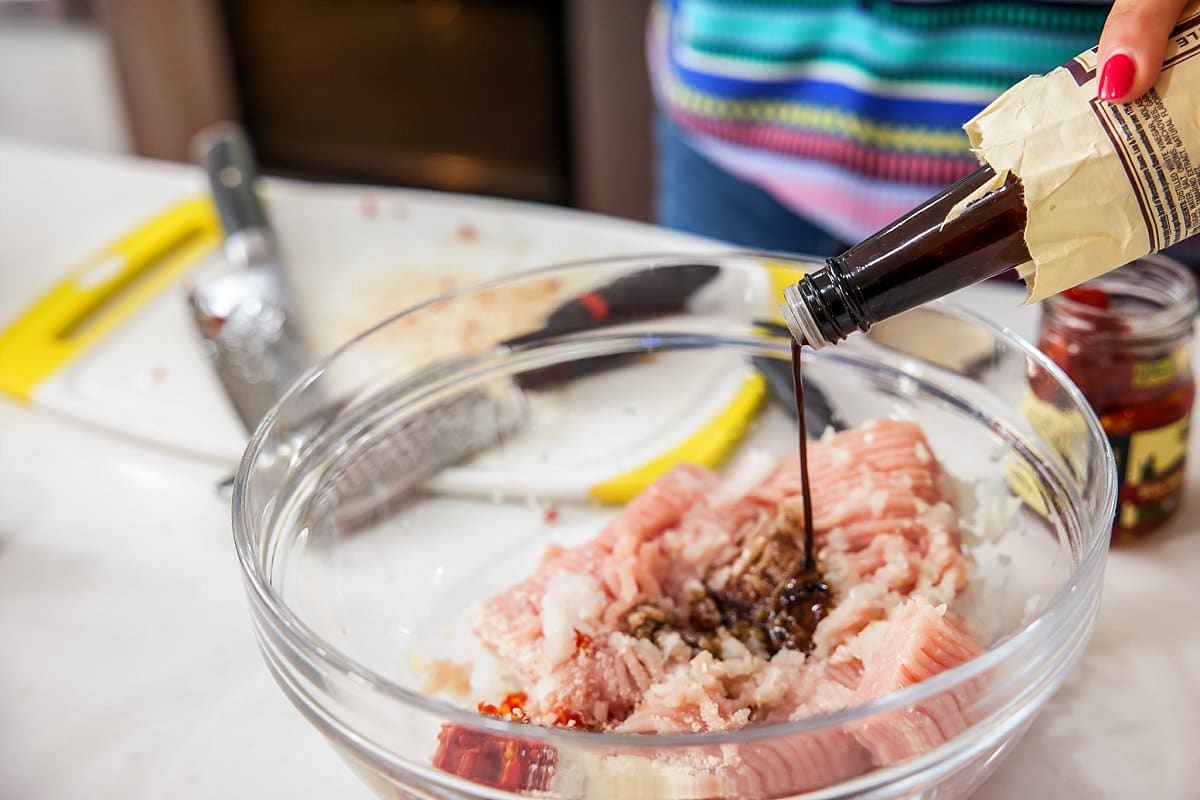 Adding Worcestershire sauce to bowl