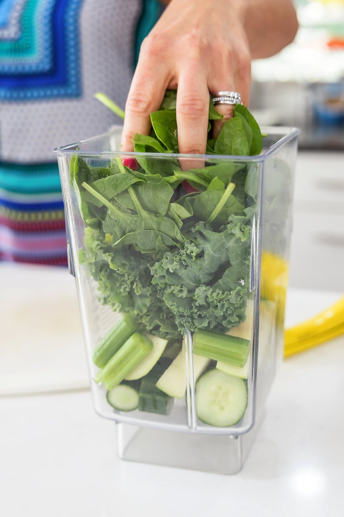 Adding spinach to blender