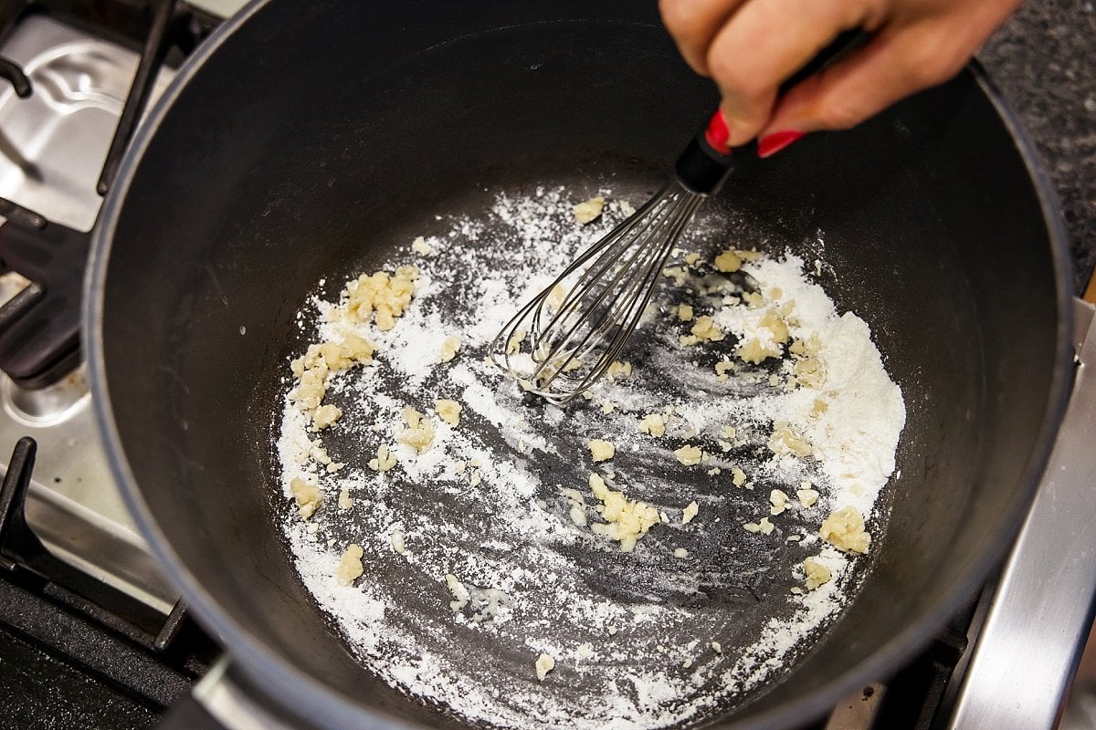 person making a roux