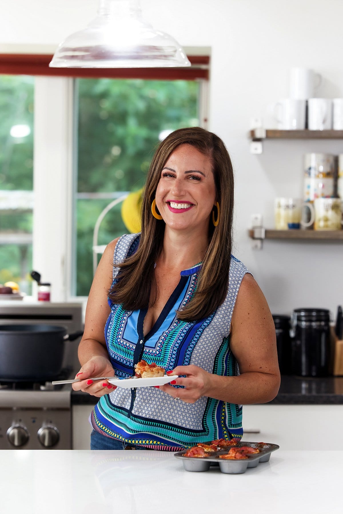 Liz with turkey meatloaf muffins with bacon.