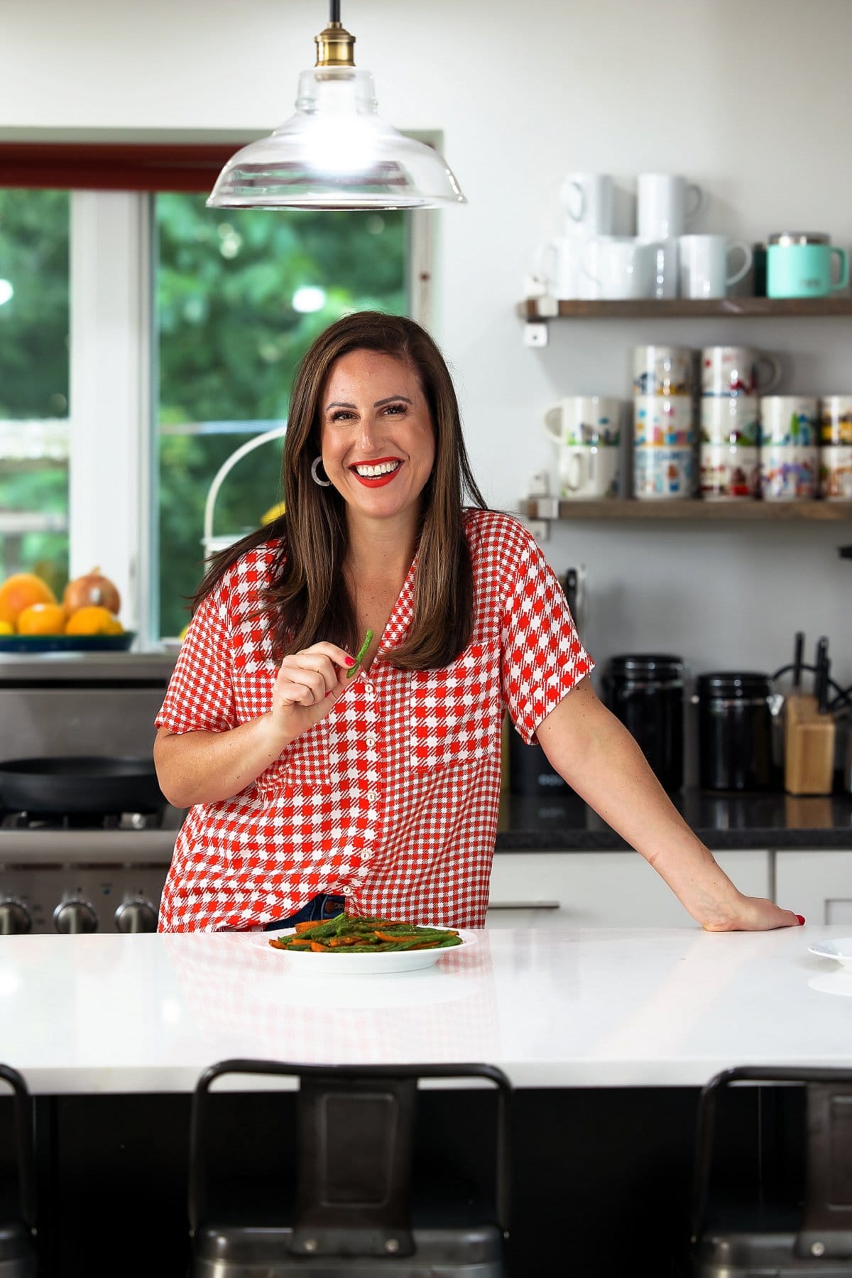 Liz eating Za’atar roasted carrots and green beans.