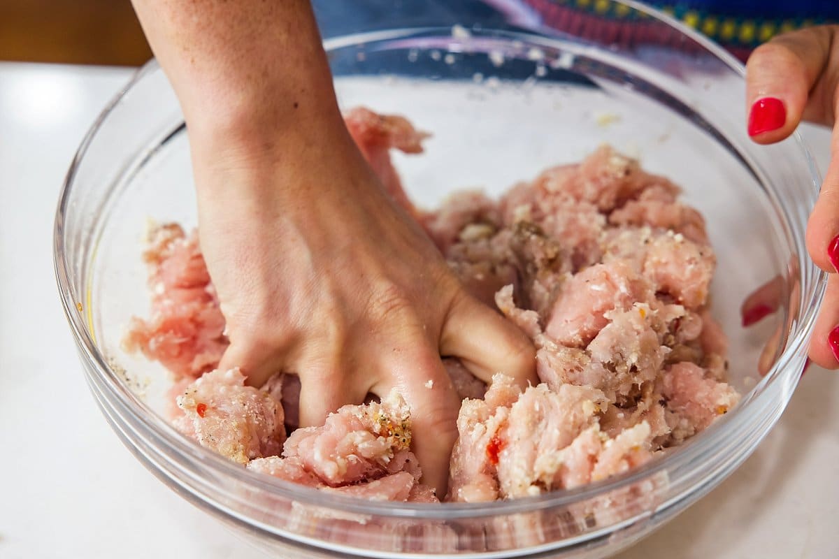 Liz hand mixing turkey meatloaf.
