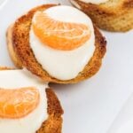 Crostini garnished with tangerine