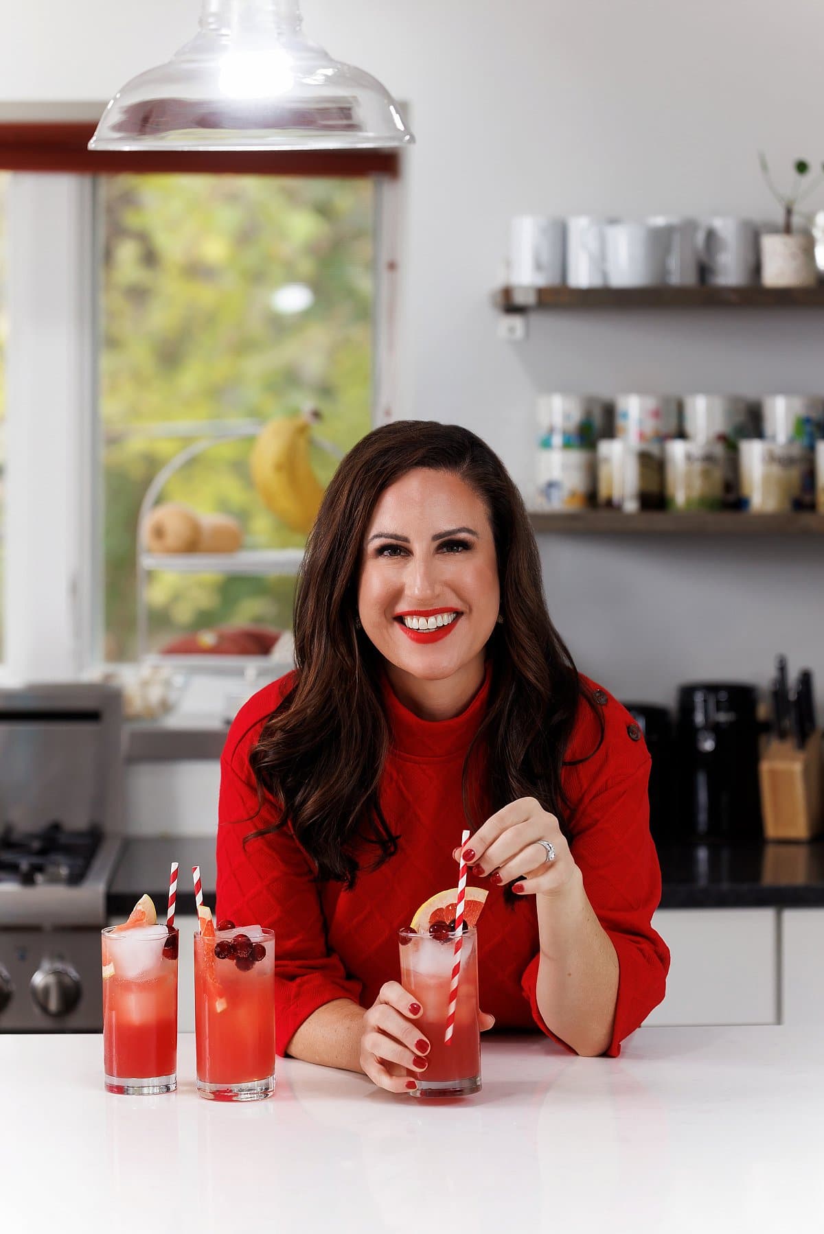 Liz drinking a seabreeze cocktail.