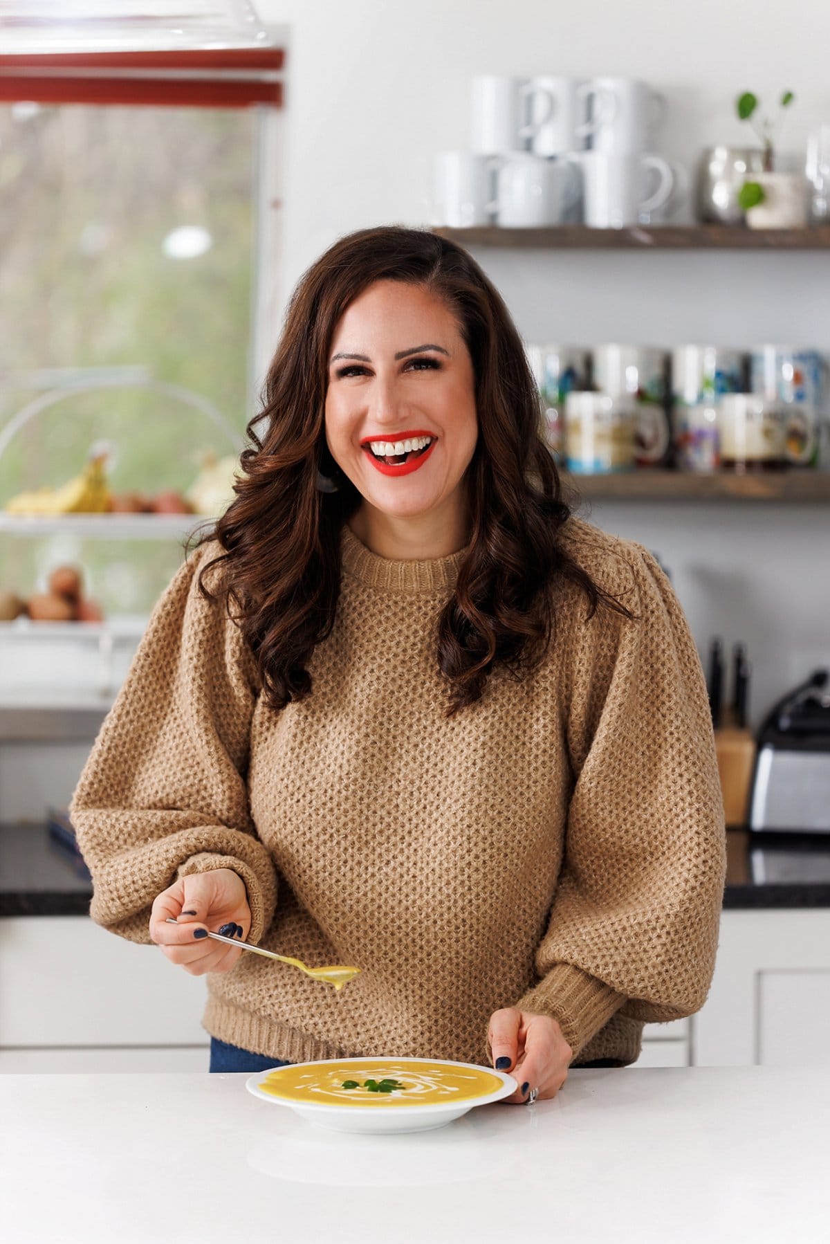 Liz eating roasted butternut squash soup.
