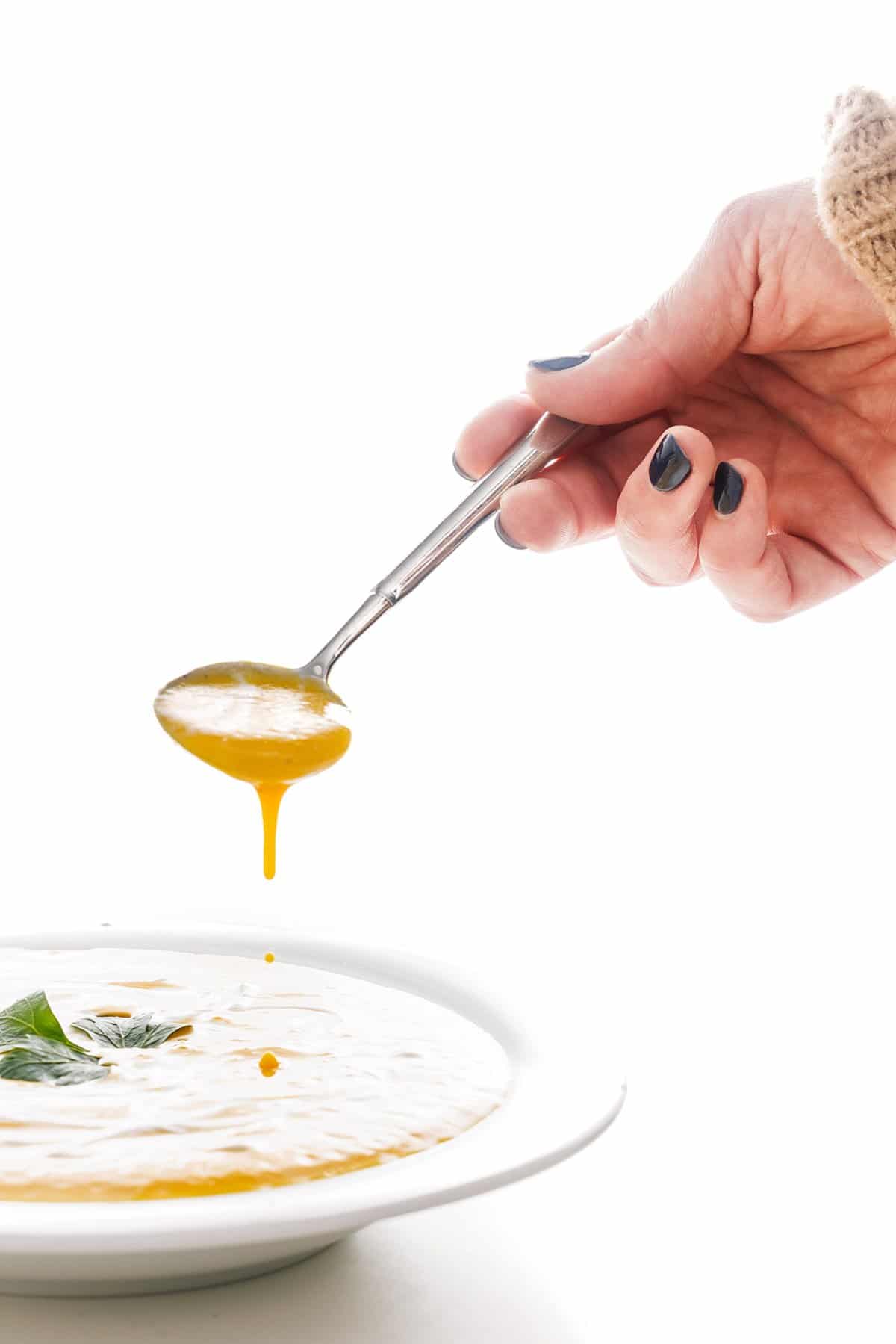 Spoonful of roasted butternut squash soup.