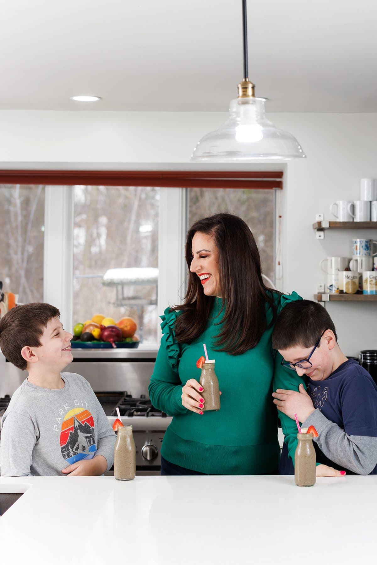 Liz and kids drinking berry smoothies- how to freeze berries.