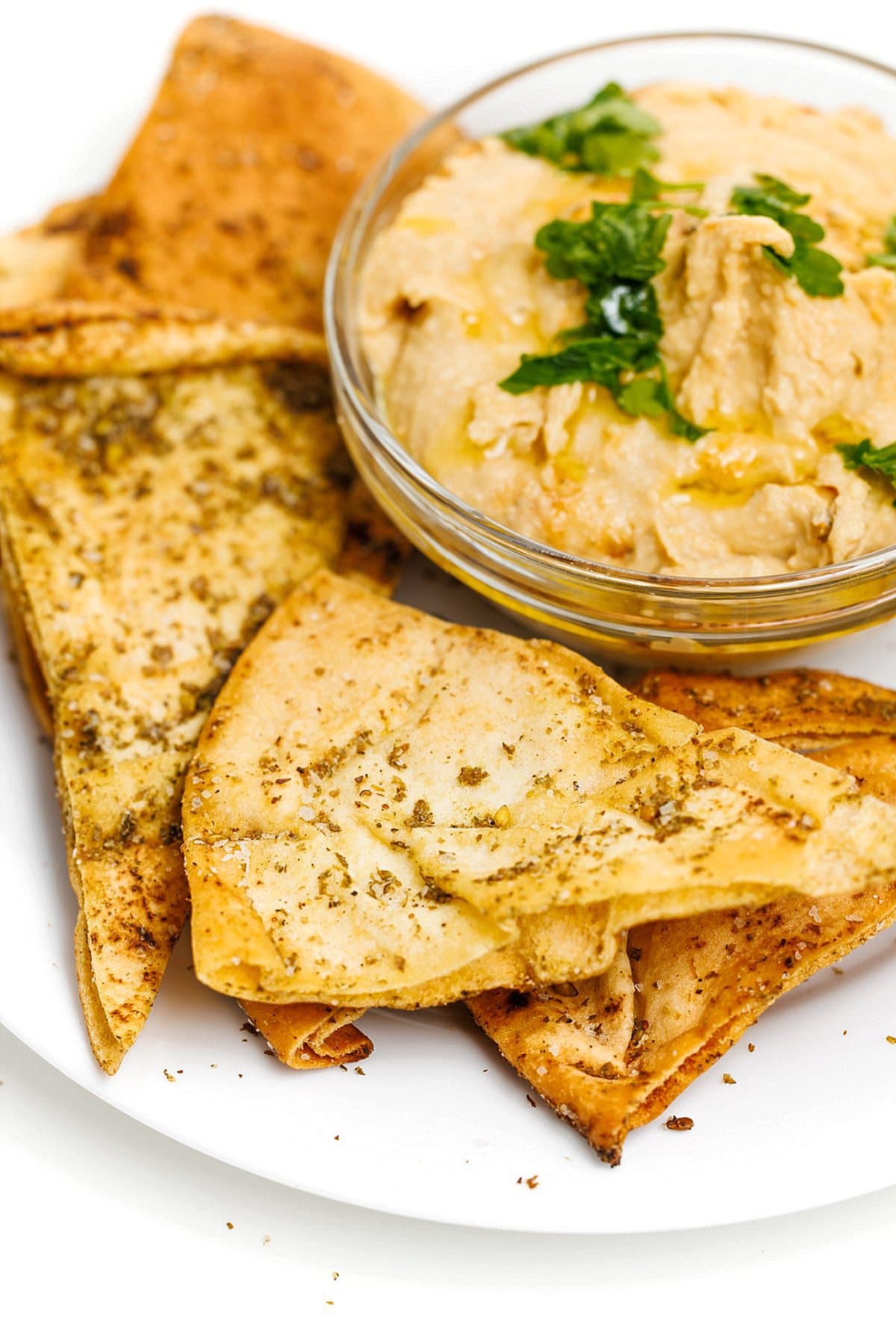 Baked pita chips with za’atar and hummus.