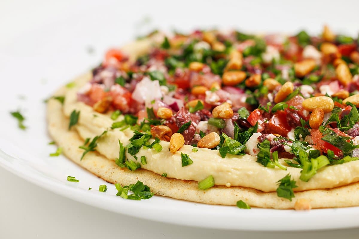 Hummus pizza with Greek tapenade.