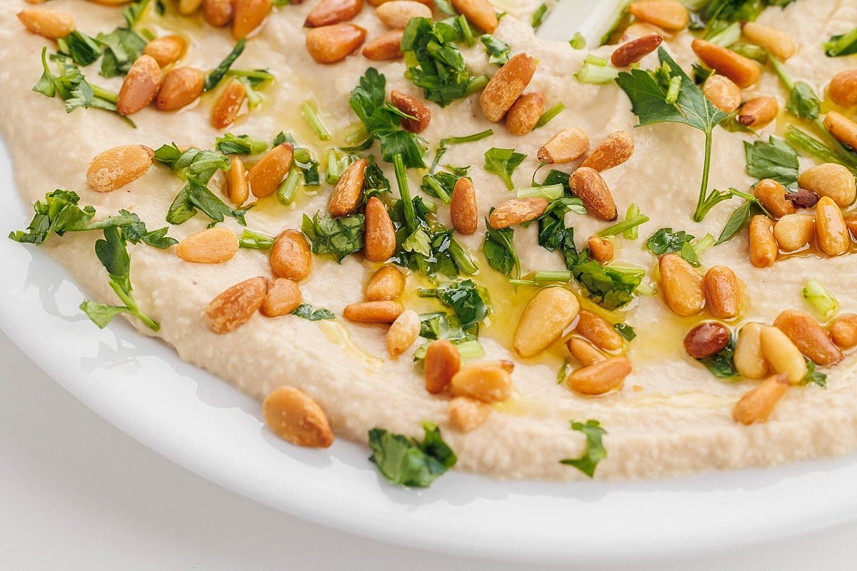 Classic hummus with toasted pine nuts.
