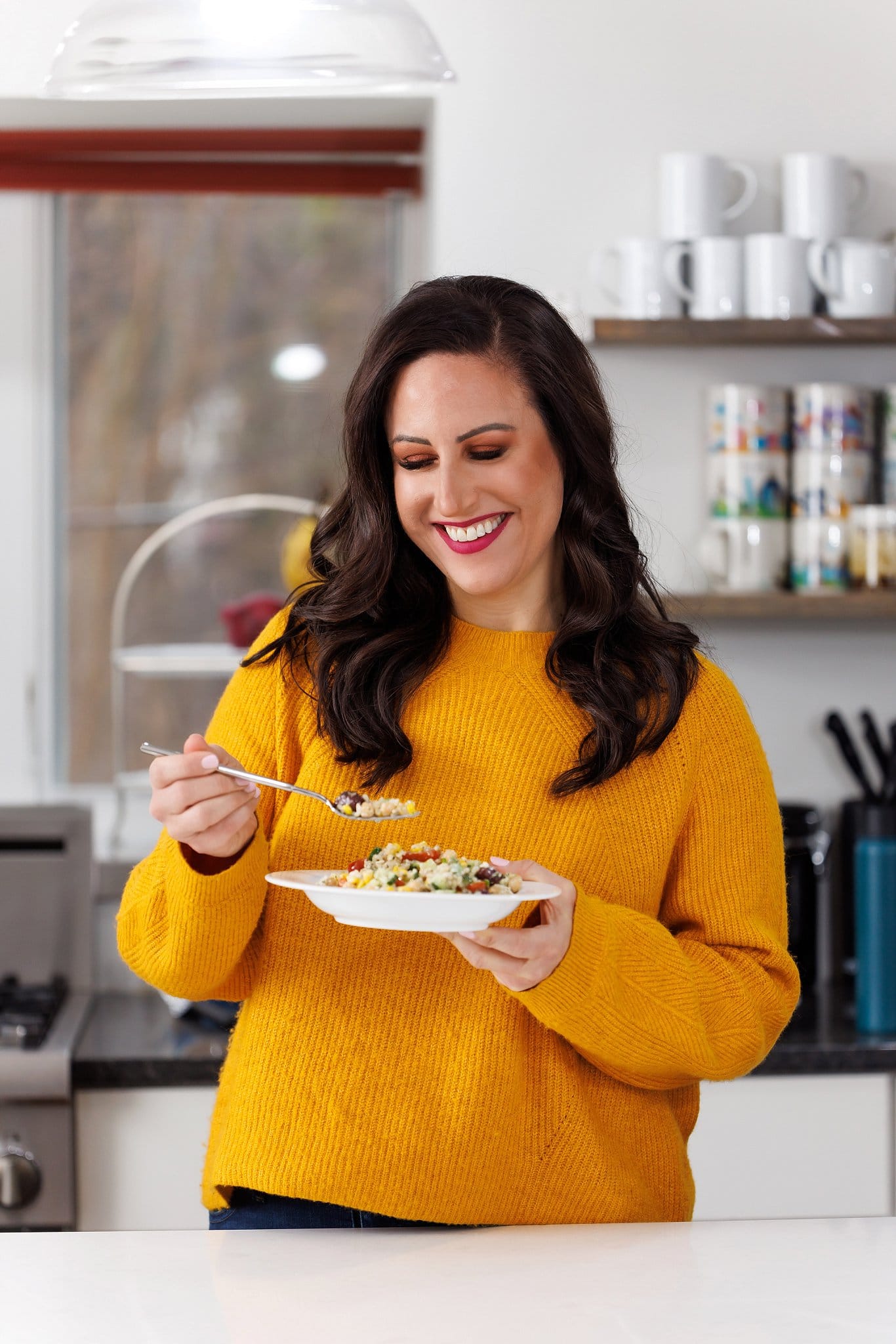 Liz eating Greek brown rice salad.