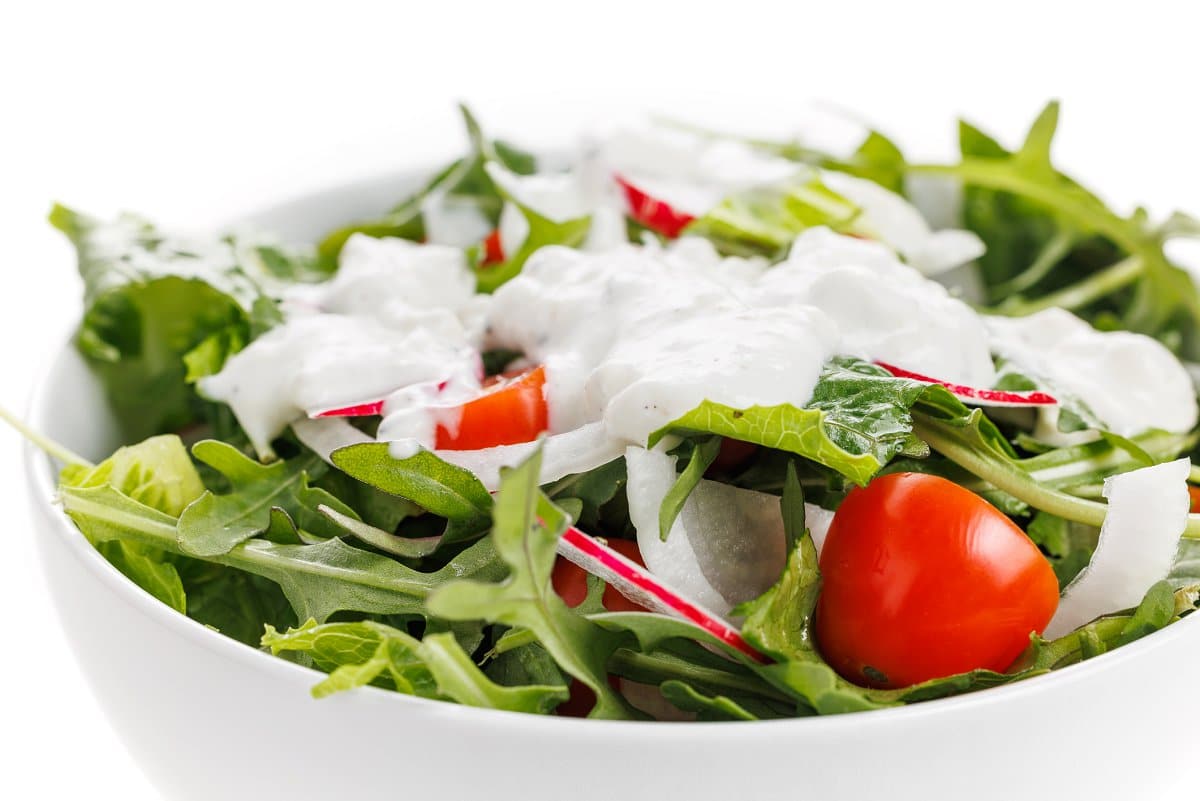 Healthy blue cheese dressing on salad.