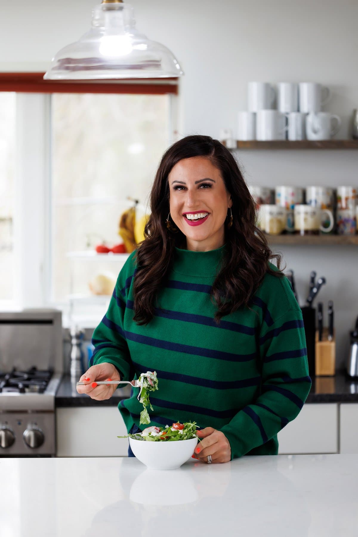 Liz eating salad with healthy blue cheese dressing.