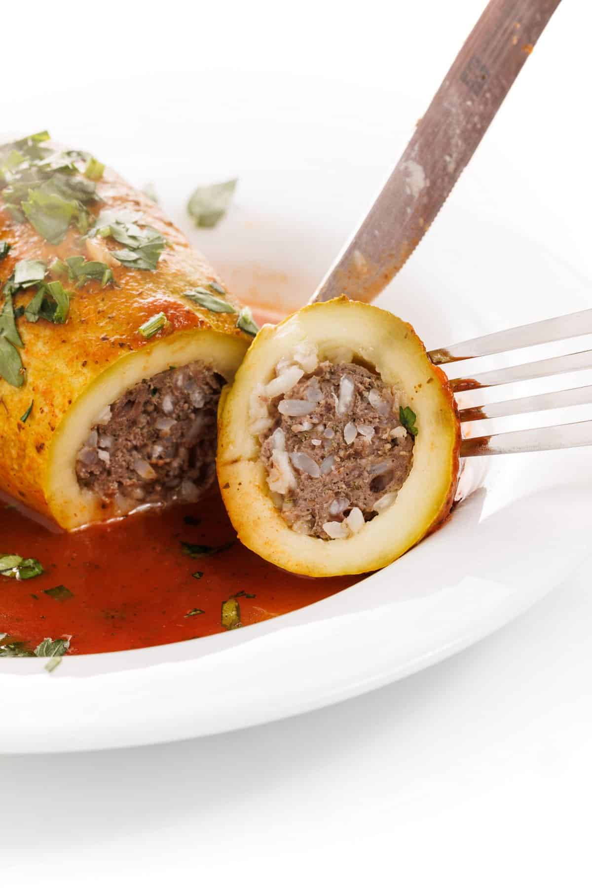 Cutting Lebanese stuffed kousa squash.
