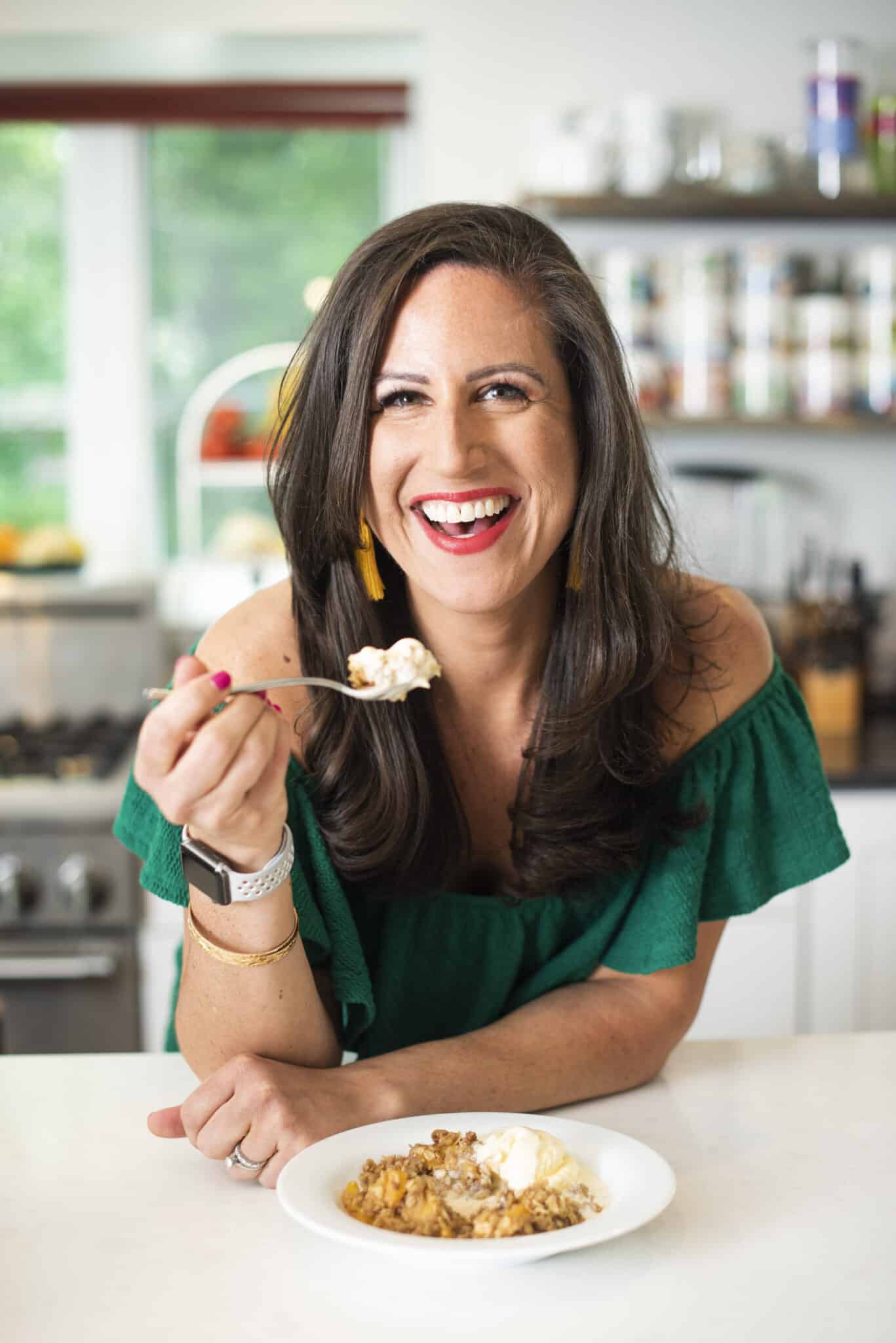 Liz eating gluten free peach crisp.