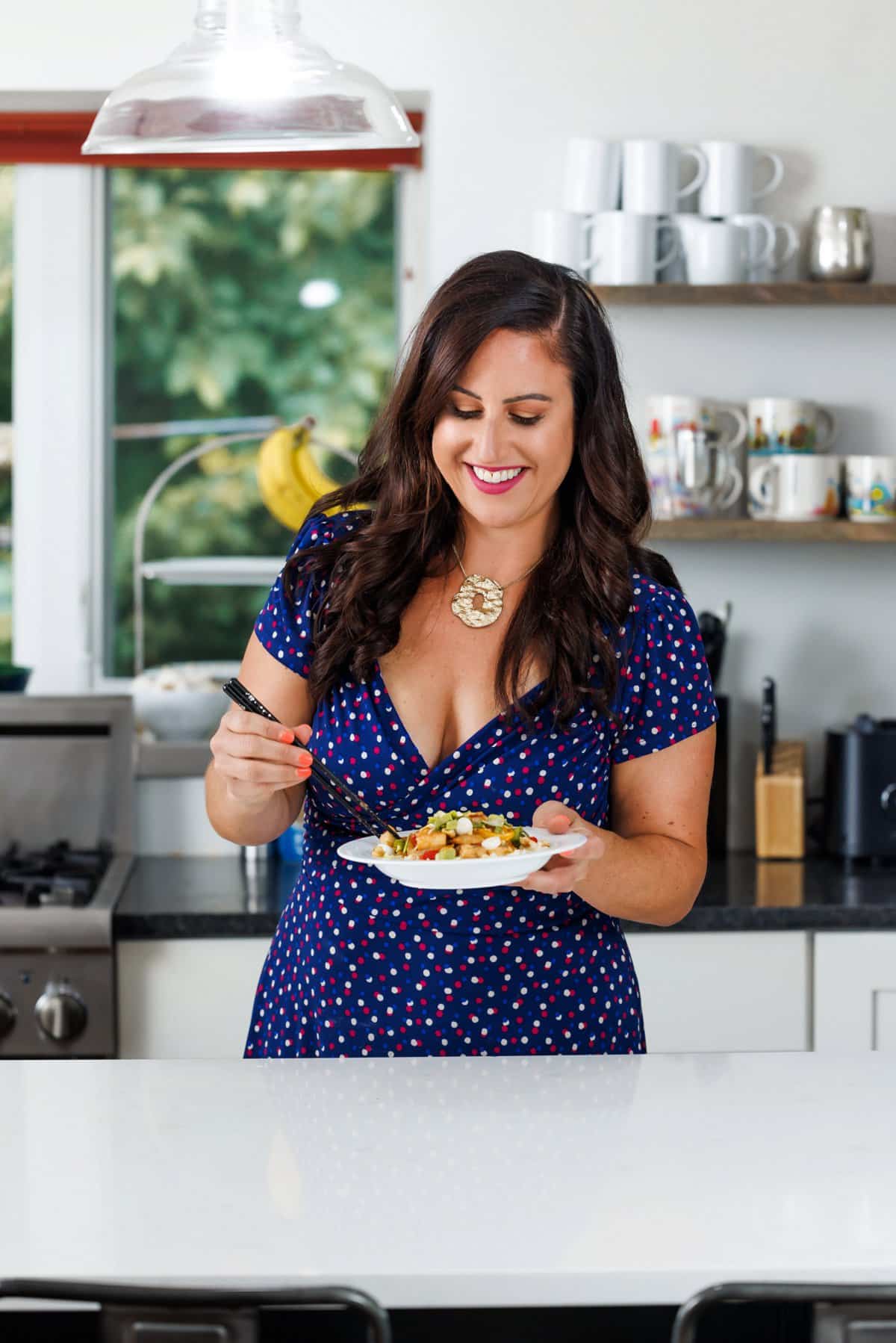Liz eating cashew chicken stir-fry.