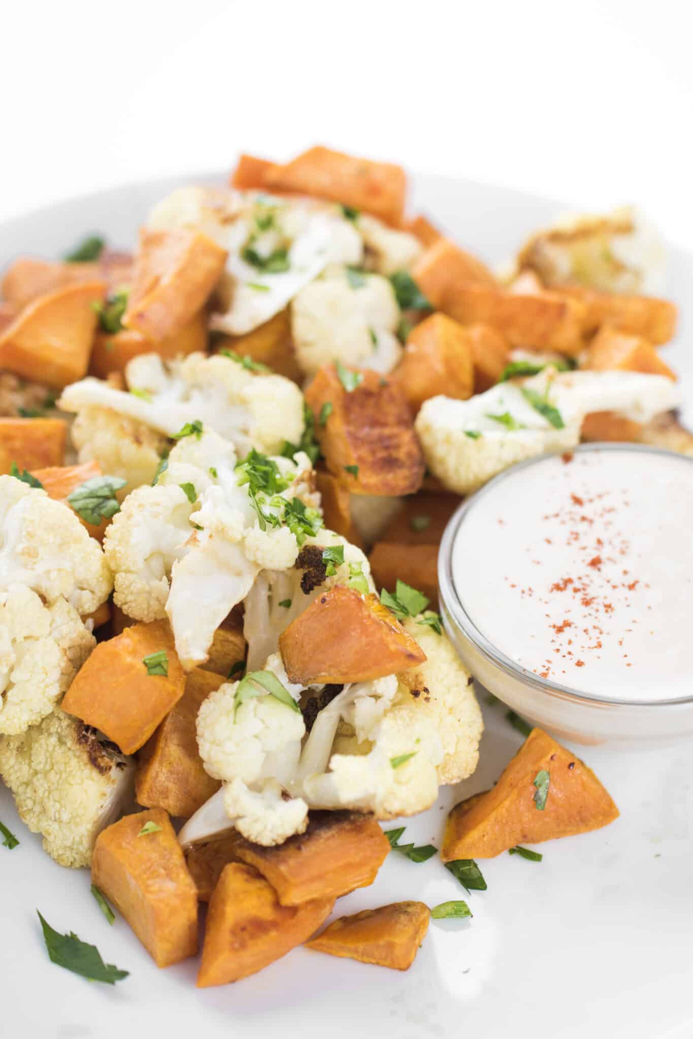 Roasted vegetables with tahini lemon sauce.