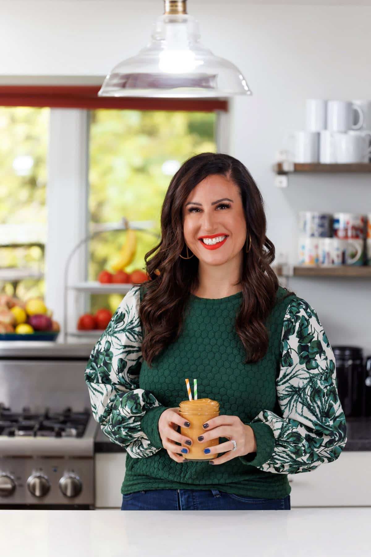 Liz drinking pumpkin pie protein smoothie.