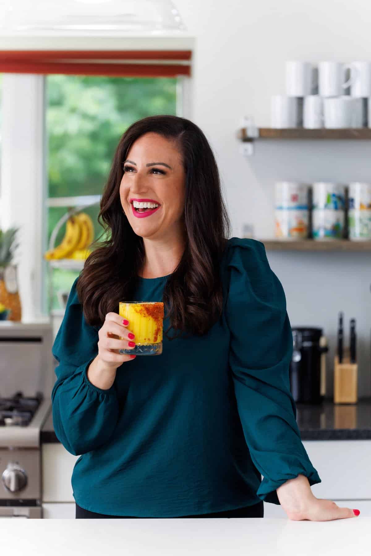 Liz enjoying a frozen mango margarita.