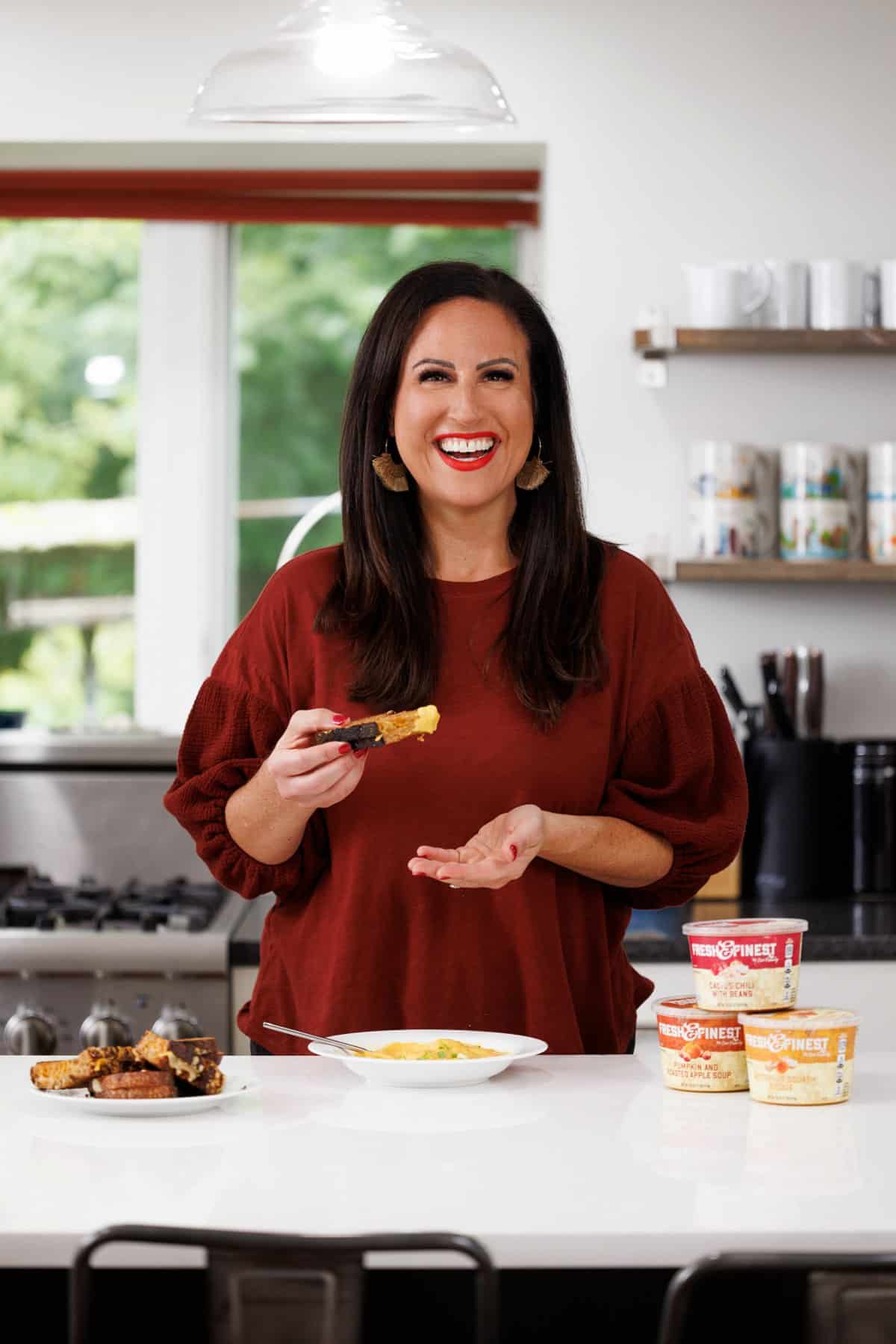 Liz eating sheet pan oven baked grilled cheese with soup.