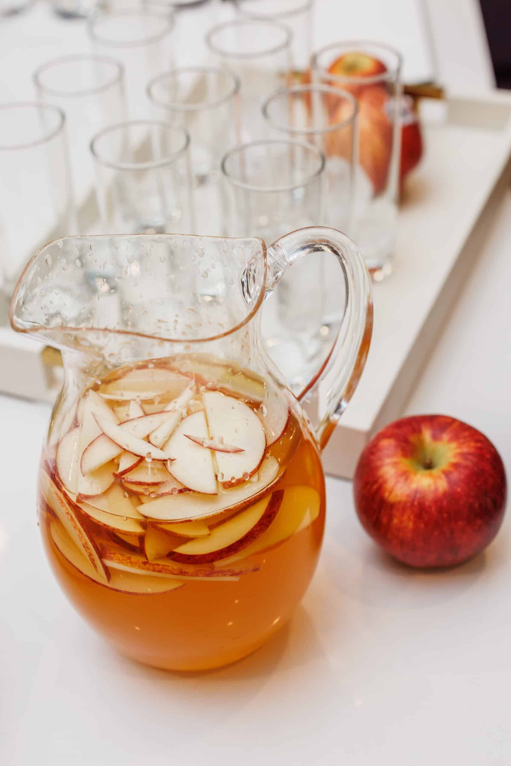 Apple gin fizz cocktail in pitcher.