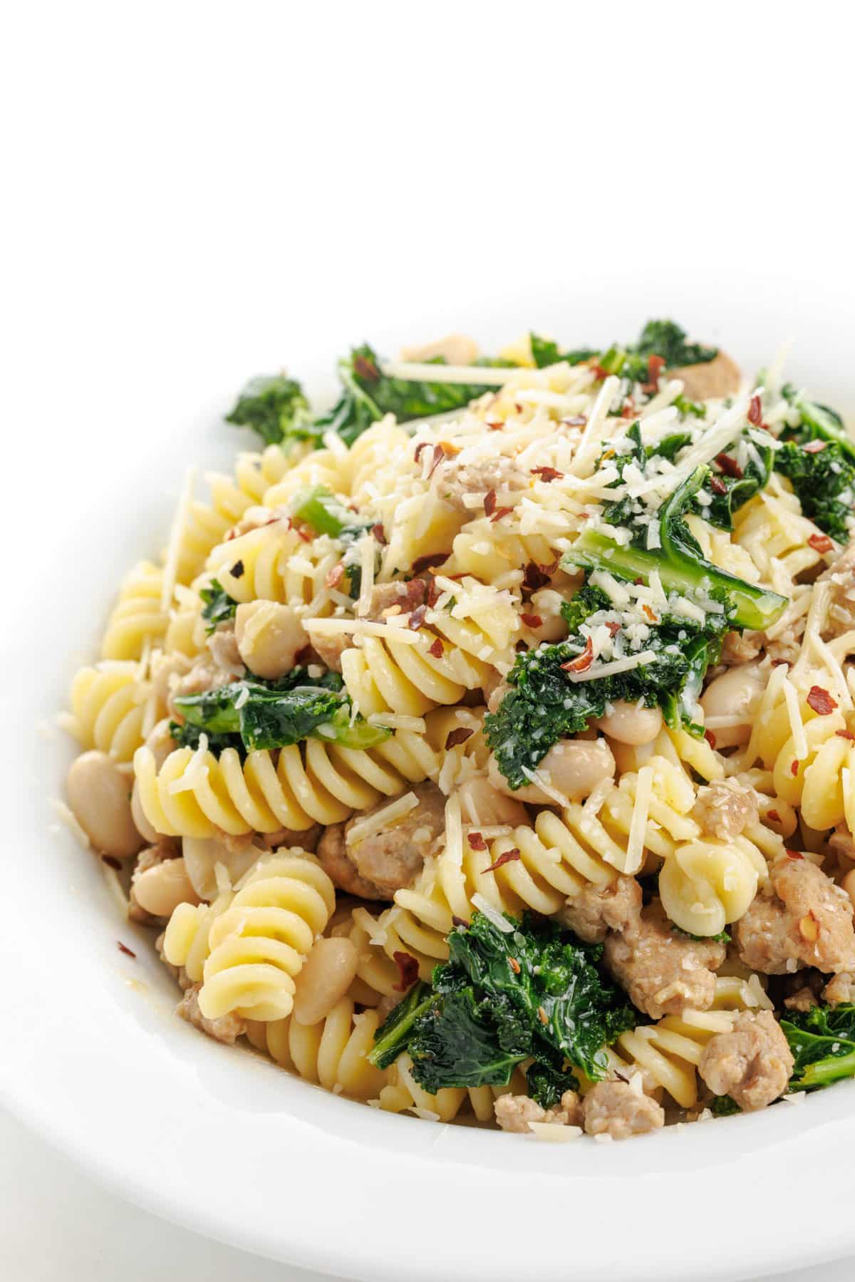 Sausage and kale pasta with white beans.