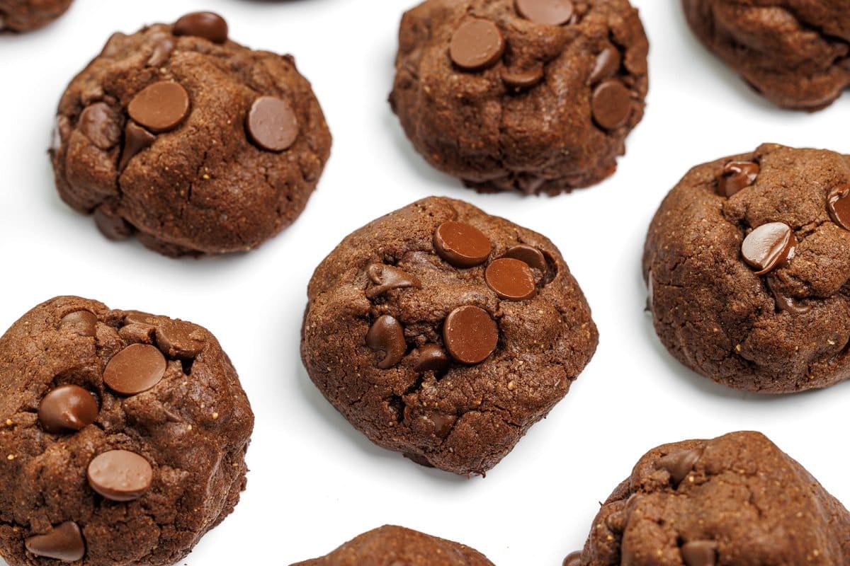 Baked buckwheat double dark chocolate brownie cookies topped with chocolate chips.