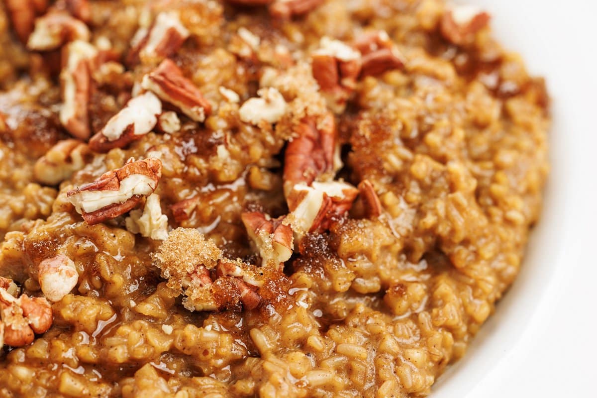 Slow cooker gingerbread oatmeal up close topped with walnuts, one of 20 cozy oatmeal recipes.