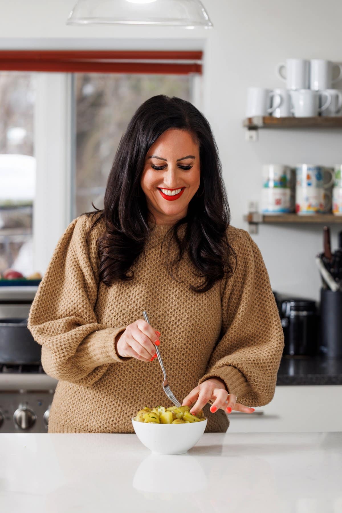 Liz eating buttered dill potatoes.