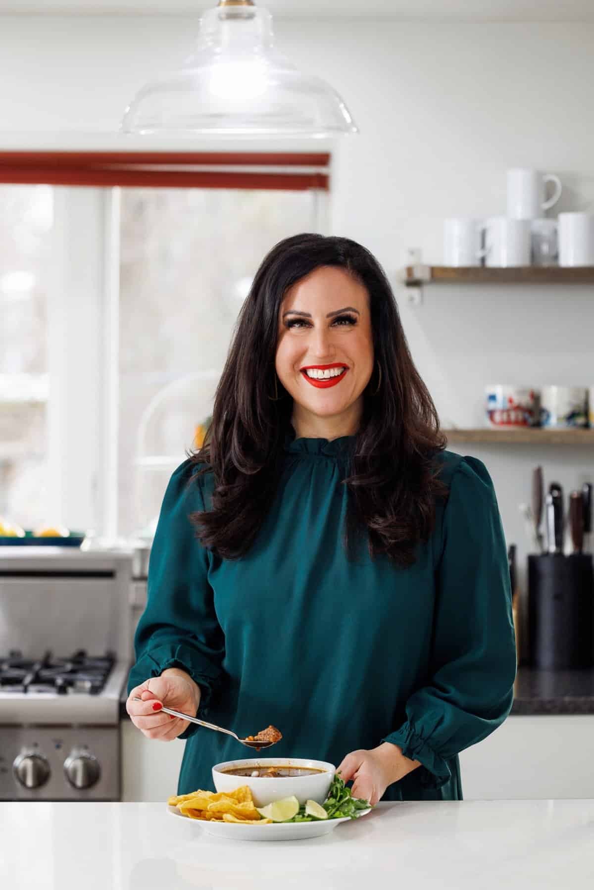 Liz eating slow cooker pozole rojo.