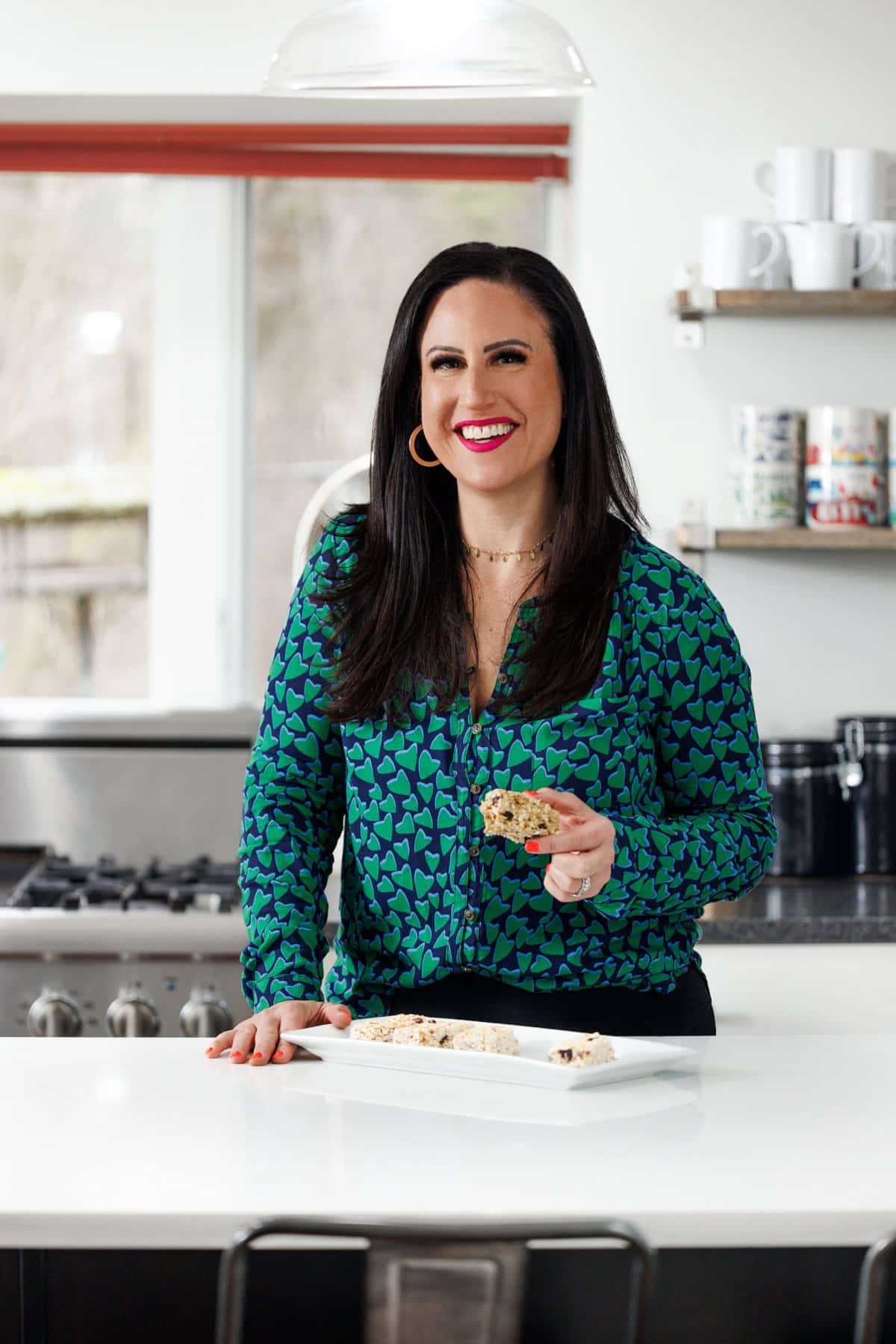 Liz eating chewy oatmeal raisin granola bars.